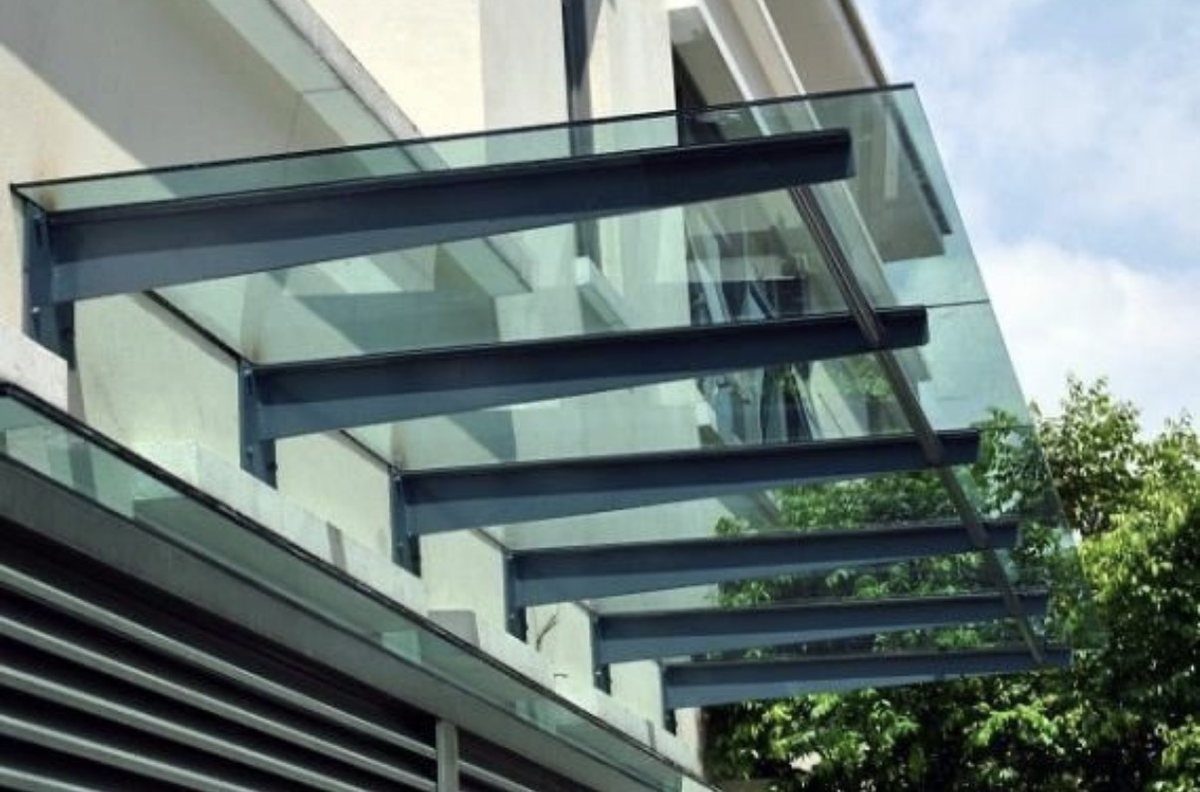 Glass canopy with cantilevered steel bracket supports — CLEV installation